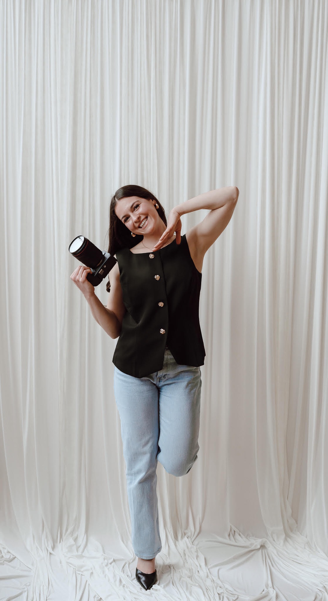 Emily in the studio, camera in hand