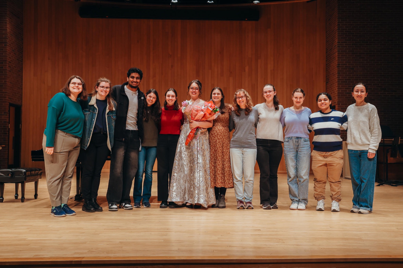 Performers gathered on stage after a recital