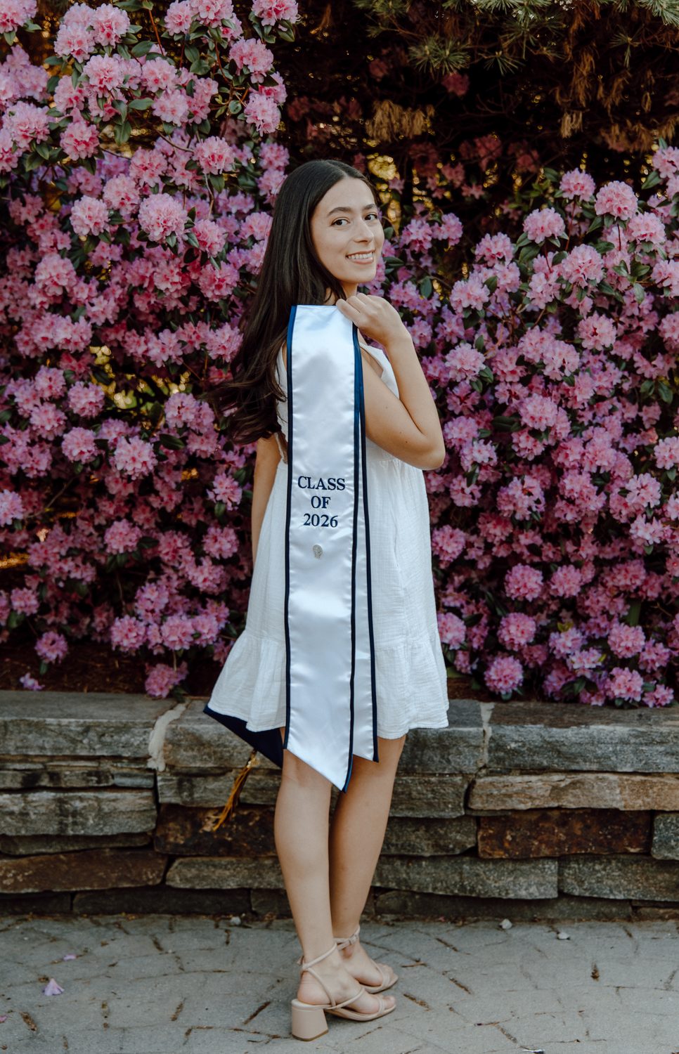 A graduate among spring blossoms